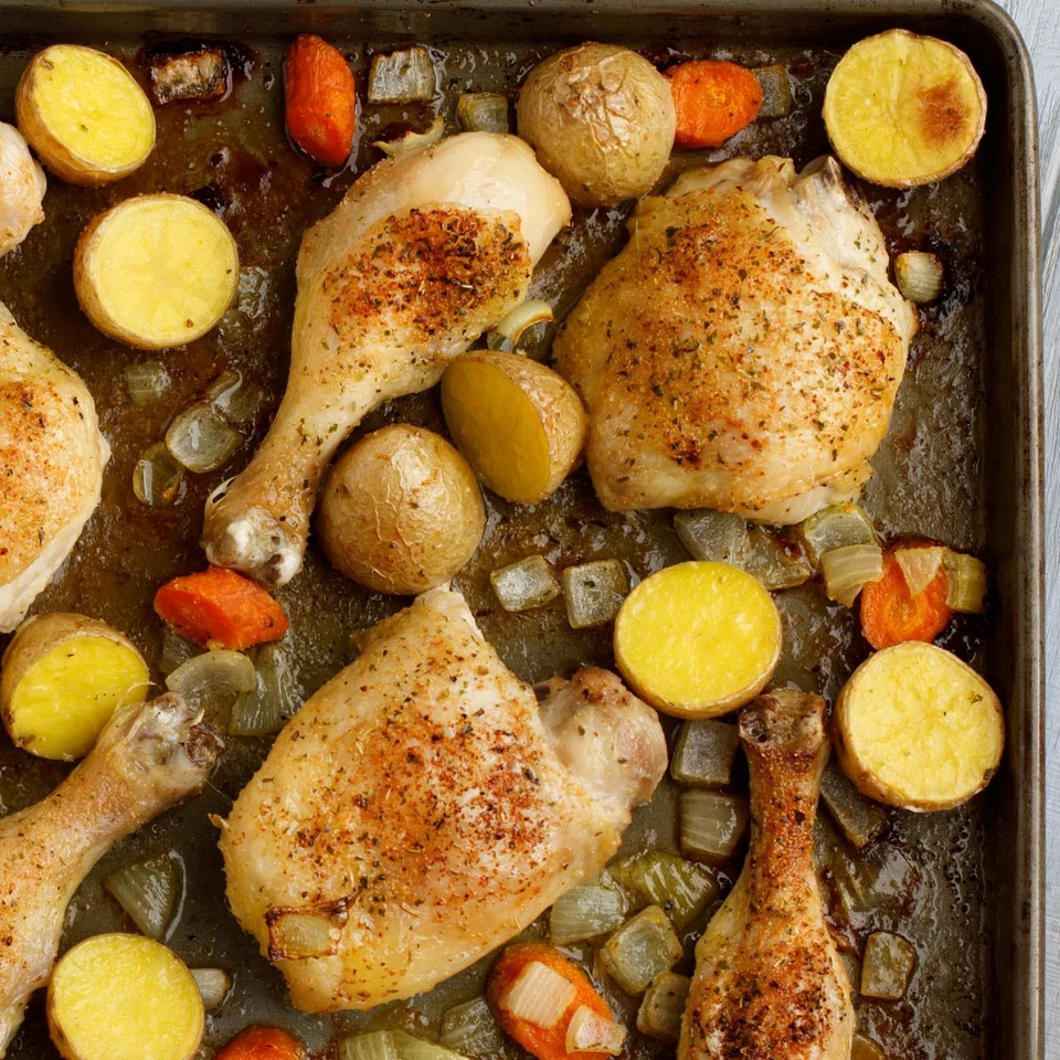 Roasted chicken with potatoes, carrots and onions