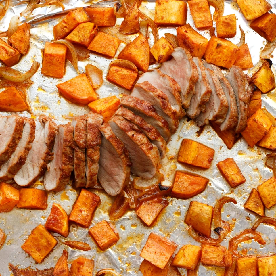 Sliced pork tenderloin with roasted sweet potatoes